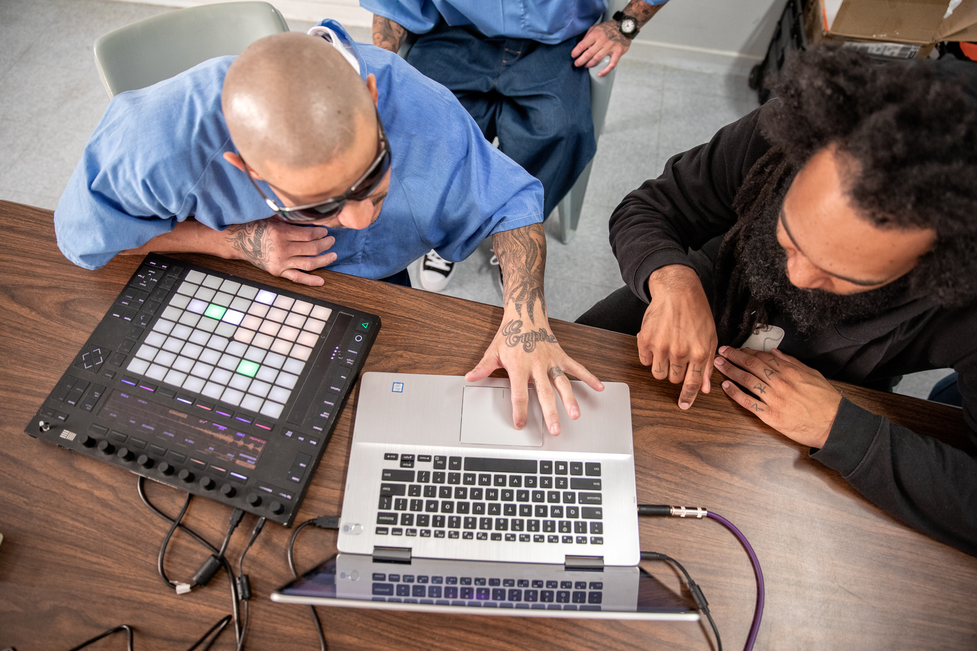 Audio production students work on a laptop at California State Prison—Solano